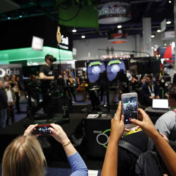 hype at trade show crowd filming vr guy at ces